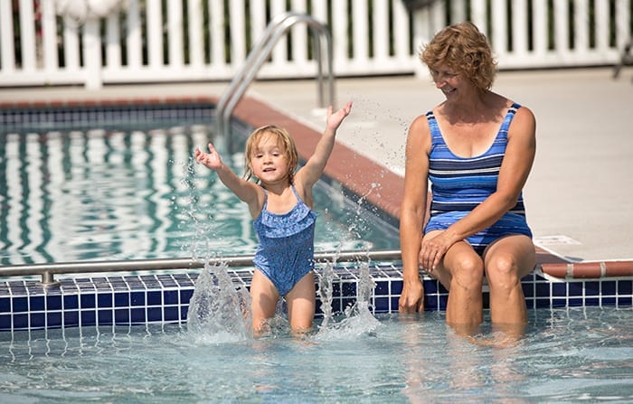 A little girl and her mother Country Acres Campground Pool