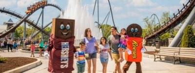 A family visiting Hershey Park for the day before resting at Bird-in-Hand Family inn.