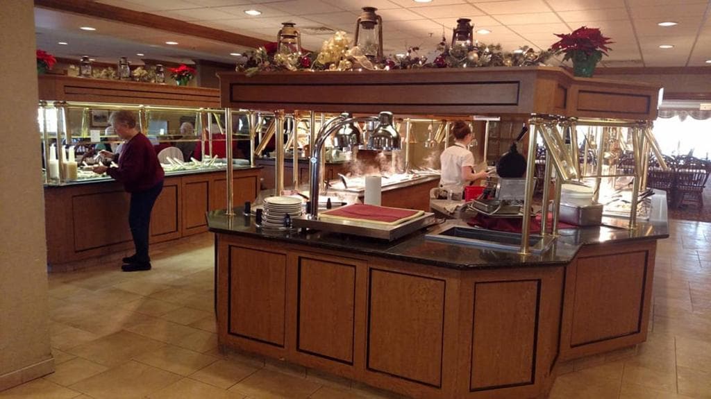 People getting food at Bird-in-Hand Restaurant and Smorgasbord in Bird-in-Hand, PA located next to the Family Inn