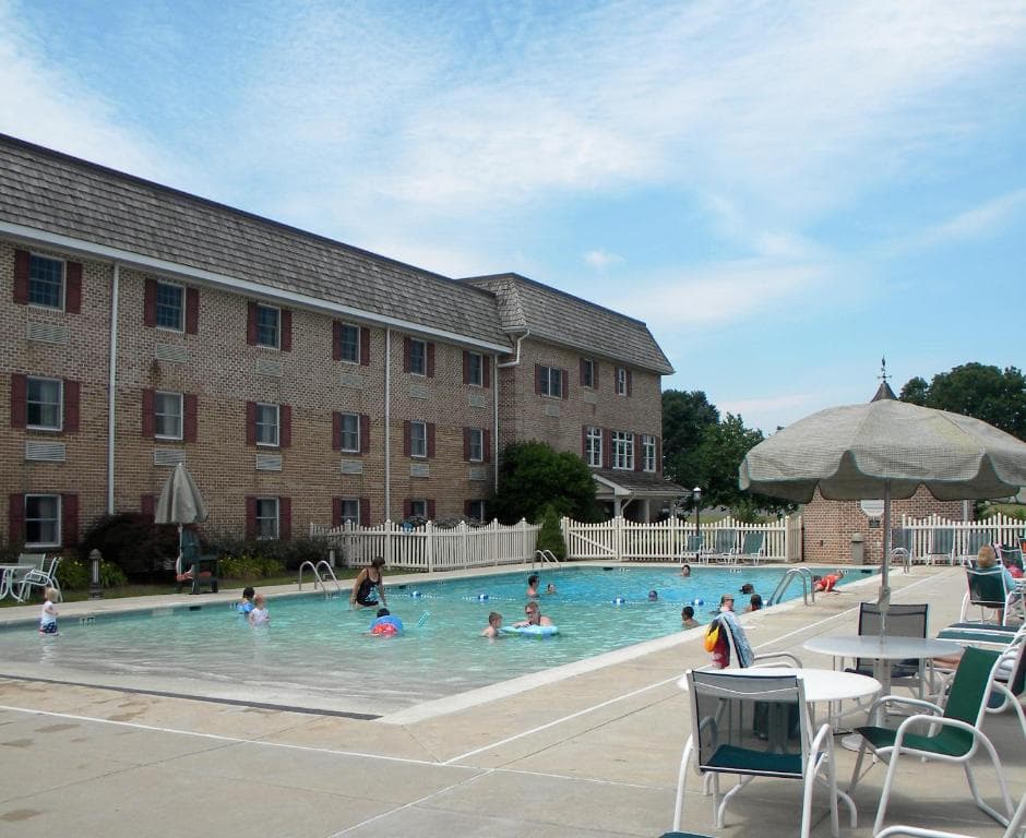 People swimming at the Bird-in-Hand Family Inn outdoor pool